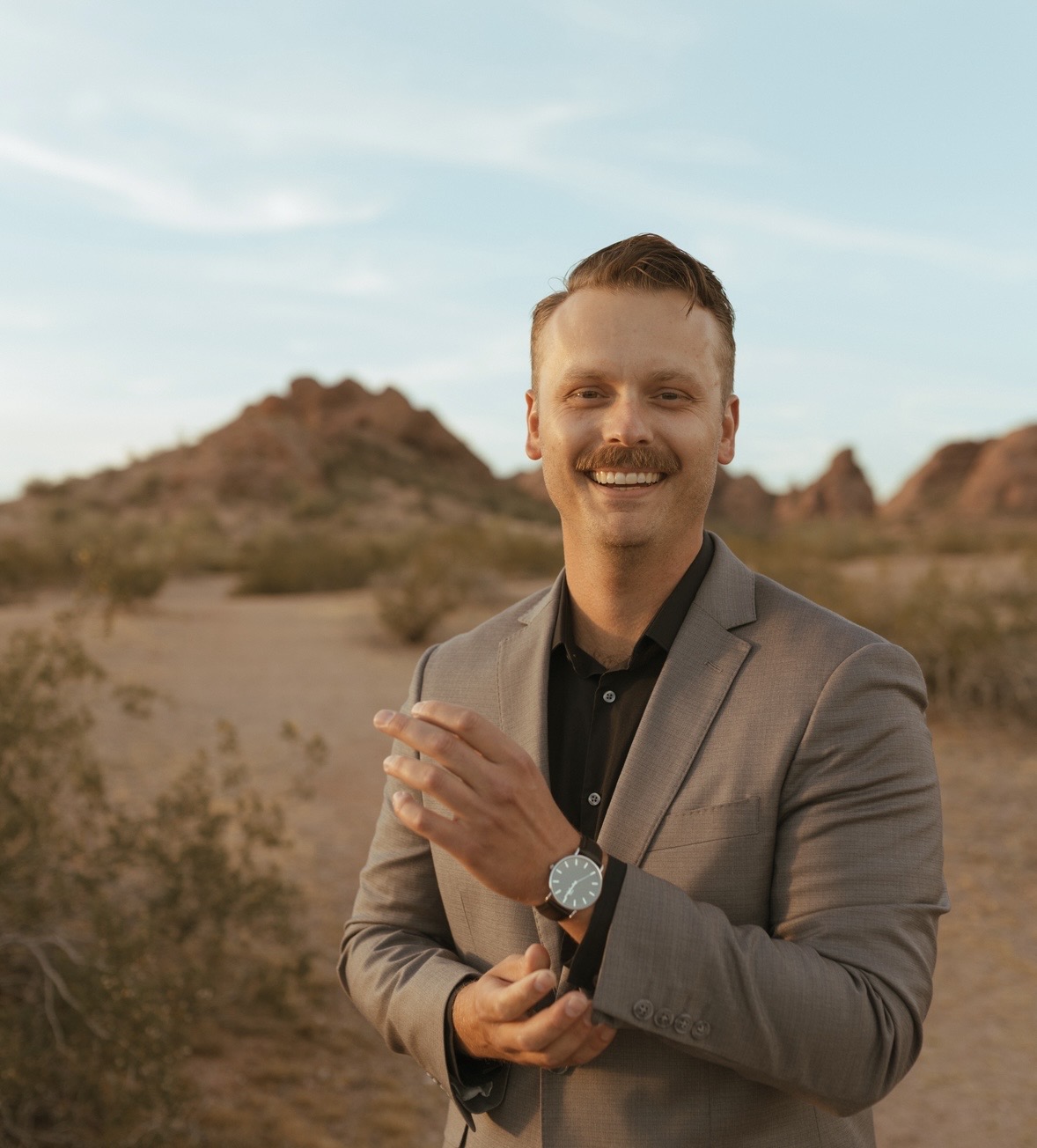 Austin Bangma standing outdoors in the Arizona desert